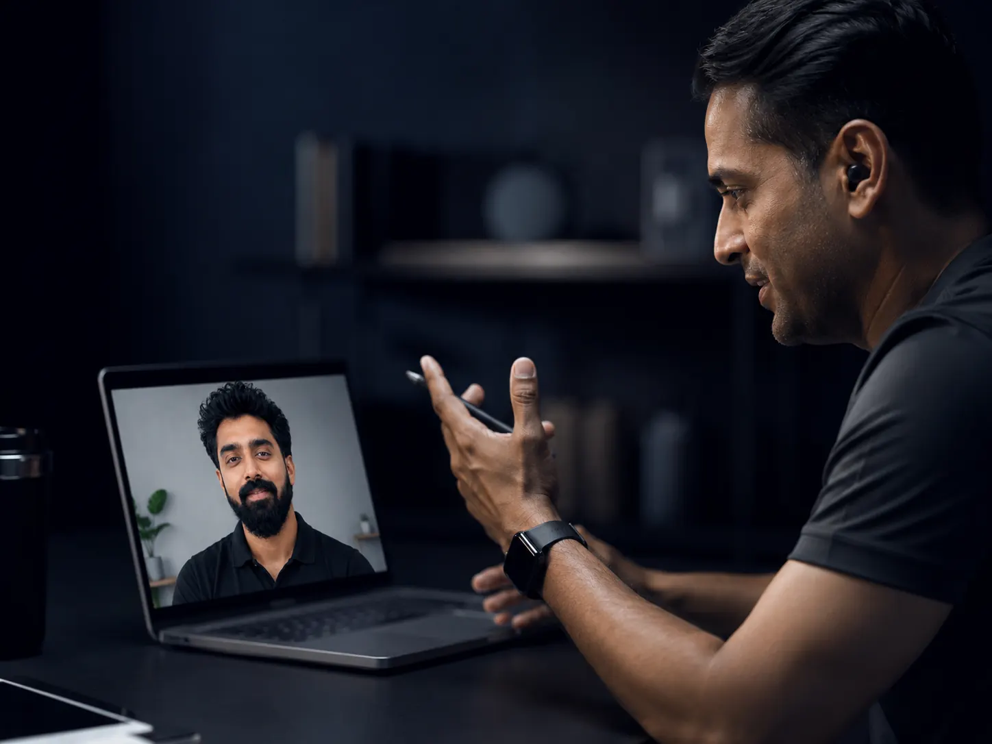 A coach on a focused one-on-one video review call giving a client undivided attention, calm and private premium setting