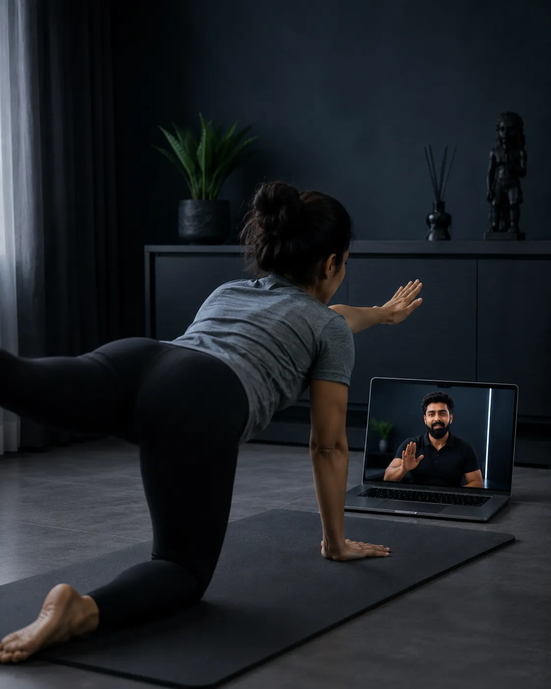A coach guiding a client one-on-one through a rehab session in a premium studio
