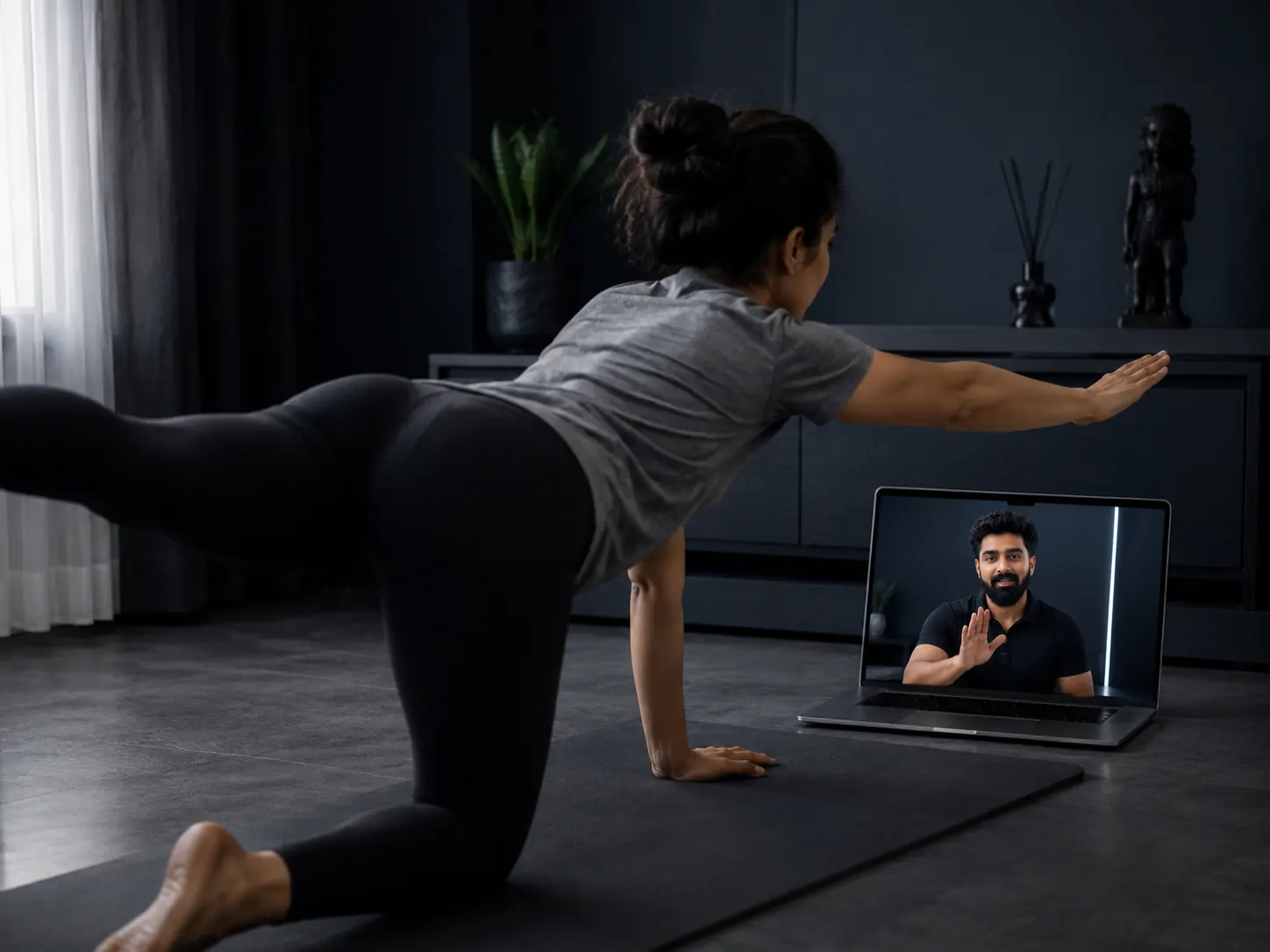 A coach guiding a client through a corrective rehabilitation movement in a premium studio, hands-on physio-style form correction